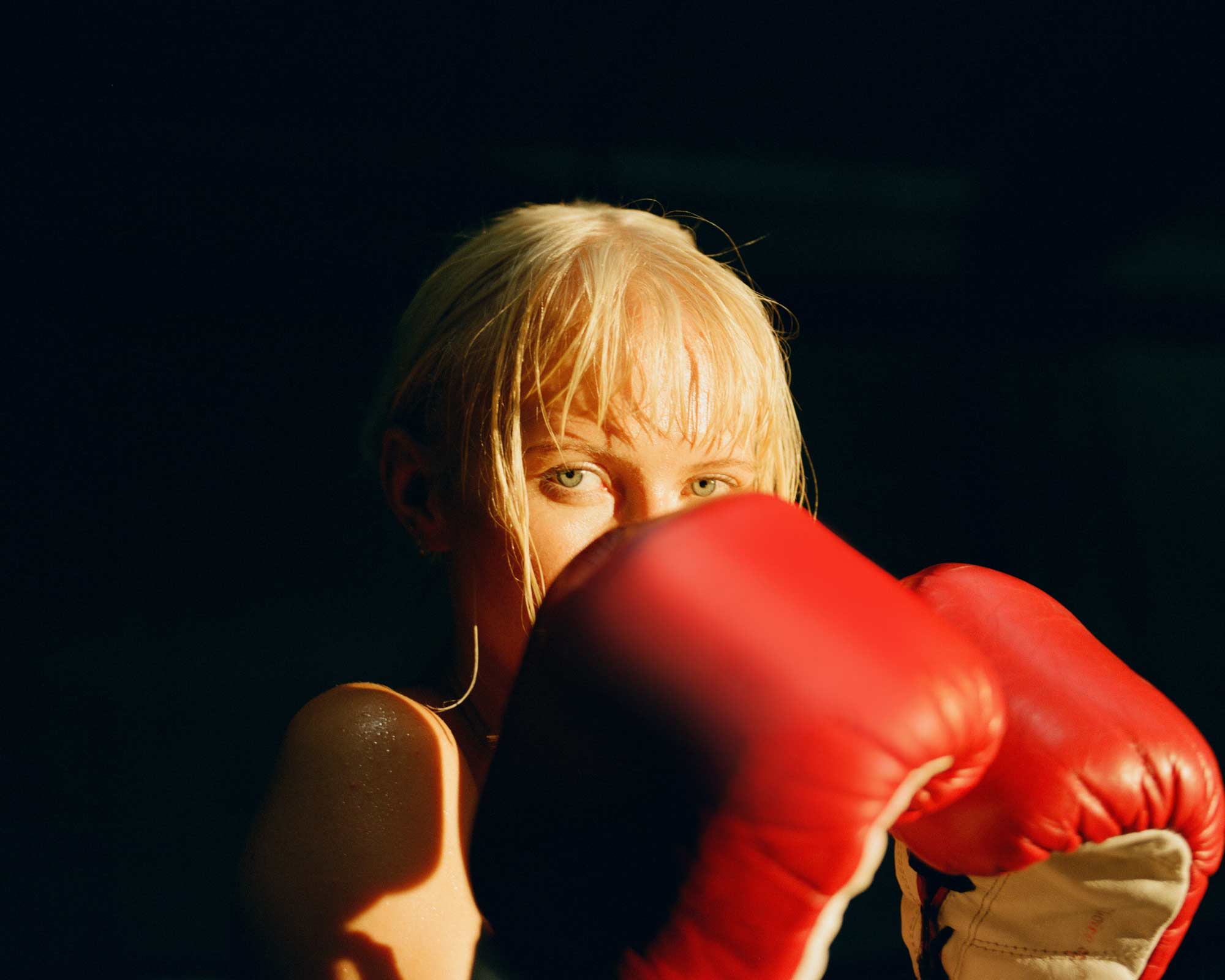 Woman wearing boxing gloves